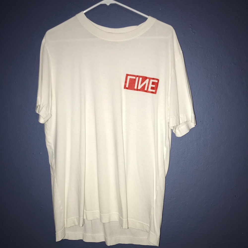 White shirt, red lettering